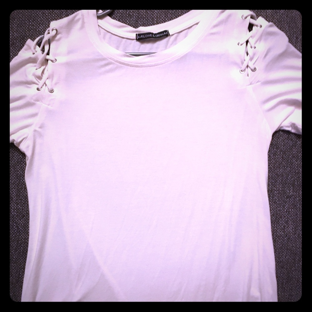 Really cute white top with laced shoulders